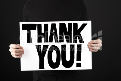 Man holding poster with thank you