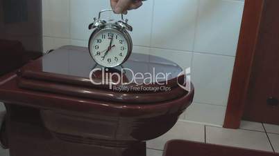 Alarm Clock on the Toilet Bowl recalls taking care of health