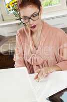 Young Businesswoman Looking at Computer Seriously