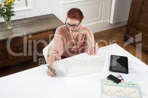 Young Businesswoman Looking at Computer Seriously