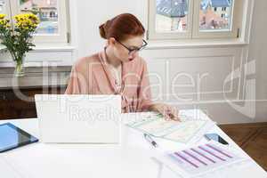 Young Businesswoman Looking at Computer Seriously