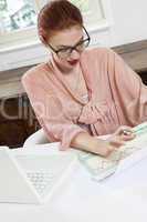 Young Businesswoman Looking at Computer Seriously