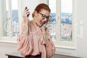Businesswoman Talking Through Phone at the Office