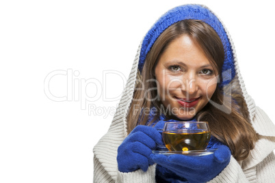 Fashionable young woman sipping hot tea