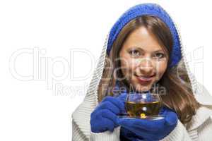 Fashionable young woman sipping hot tea