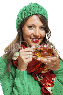 Attractive woman warming up with a cup of hot tea