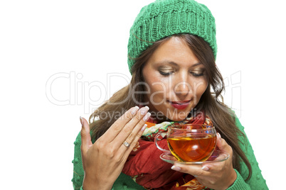 Attractive woman warming up with a cup of hot tea