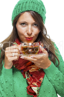 Attractive woman warming up with a cup of hot tea