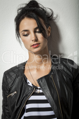 Woman in Black Leather Jacket Holding her Hair