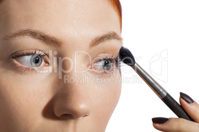 Pretty Woman Applying Eye Shadow Makeup