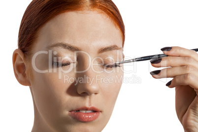 Pretty Woman Applying Eye Shadow Makeup