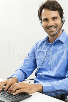 Man wearing headset giving online chat and support