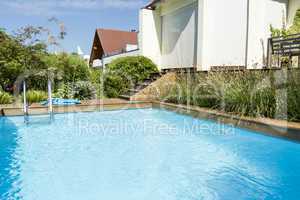 Swimming Pool next to Modern Building