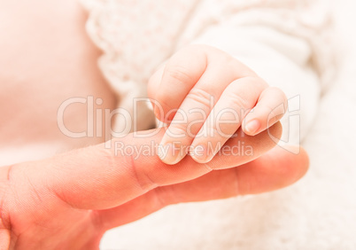 Hand of the newborn child