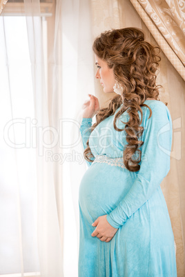 Pregnant woman in white shirt