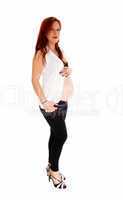 Pregnant woman holding belly.