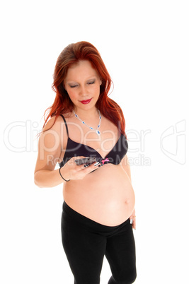 Pregnant woman on cell phone.