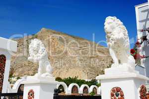 Building decorated with lion statues, Santorini island, Greece