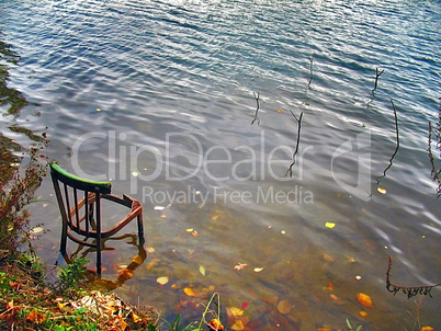 Landscape with a chair fisherman and water