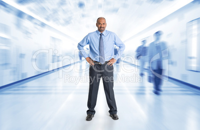 Indian businessman standing at corridor