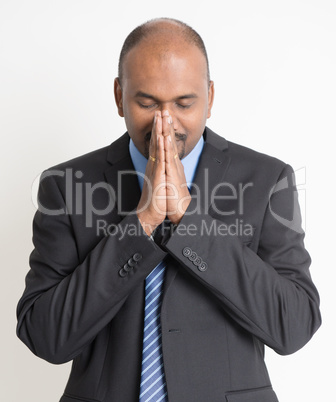 Indian businesspeople praying