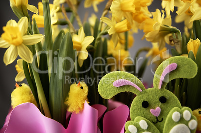 Easter bunny and yellow daffodils.