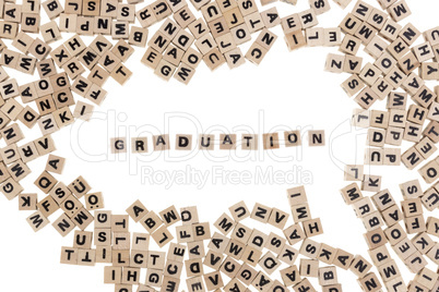 graduation written in small wooden cubes