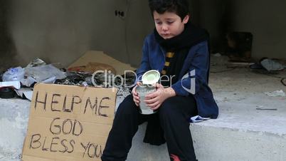 Homeless child begging in street