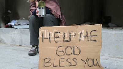 Homeless woman begging