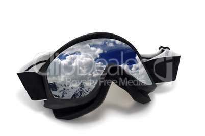 Ski goggles with reflection of cloudy mountains