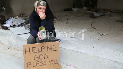 Homeless sick woman begging