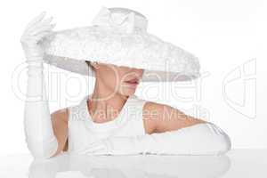 Mysterious Woman in Elegant white Hat and glowes