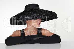 Elegant Woman Wearing Black Hat and Gloves