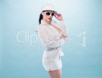 Stylish Woman in White Dress with Glasses and Cap