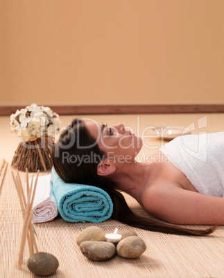 Long Hair Young Woman Lying at the Spa