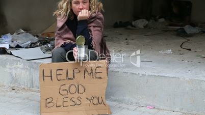 Homeless woman begging