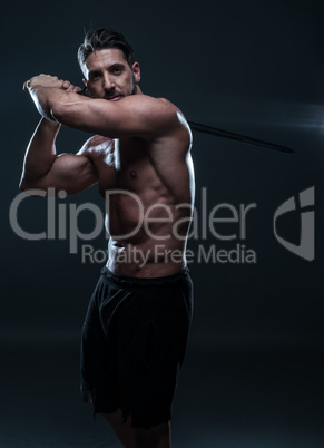 Gorgeous Shirtless Muscled Man Holding a Sword