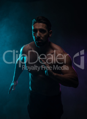 Silhouette Topless Athletic Man in a Fighting Pose