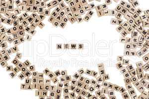 news written in small wooden cubes