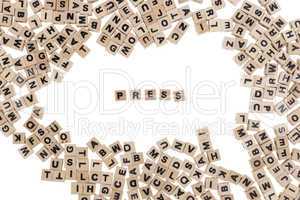 press written in small wooden cubes