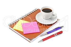 notebook and cup of coffee isolated on white background