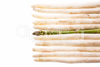 Green Asparagus Amidst Ten White Asparagus Spears
