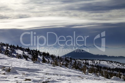 Winter mountains and cloudy sky