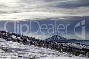 Winter mountains and cloudy sky