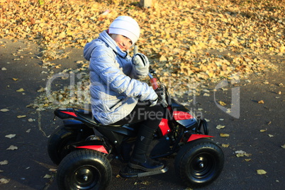 little girl driving the electric toy car