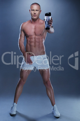 Shirtless Athletic Young Man Holding Water Bottle