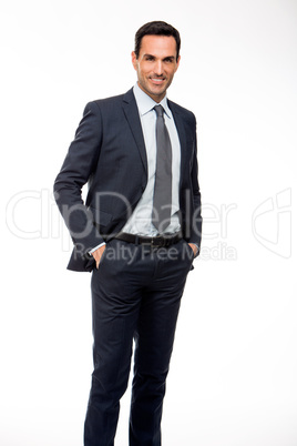 smiling businessman with hands in his pockets