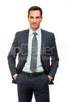 smiling businessman with hands in his pockets