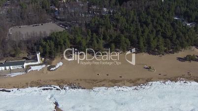 Flying above Winter Beach, sunny day