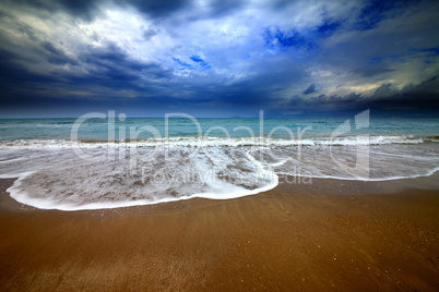 Sea beach and storm clouds